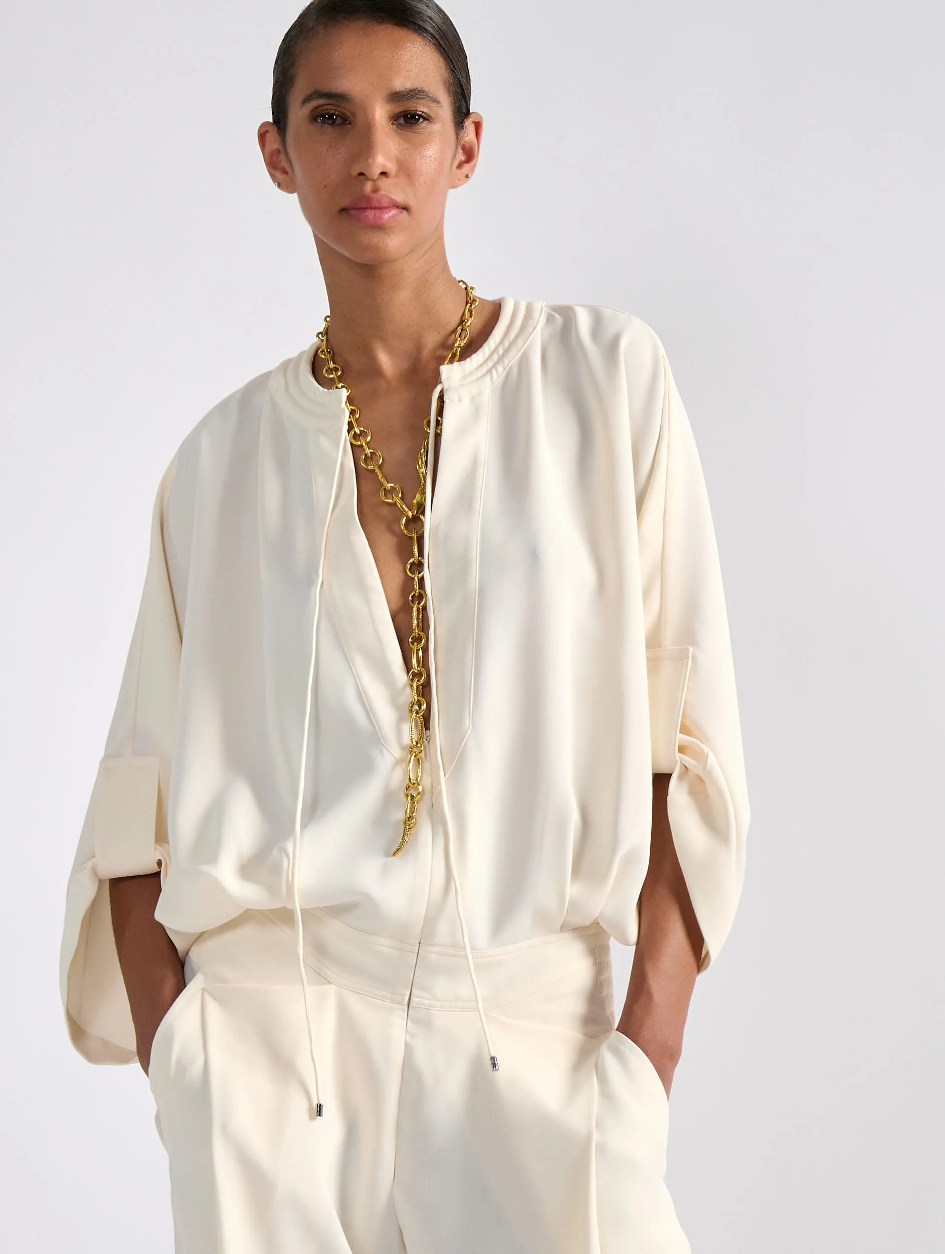 Ivory flowing caddy jumpsuit Frayed hem Recycled fibers
