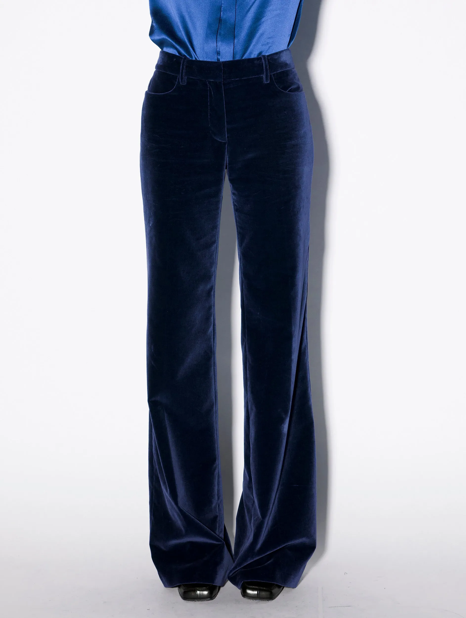 Flared blue velvet trousers Elasticized Cuffs Structured Hemline