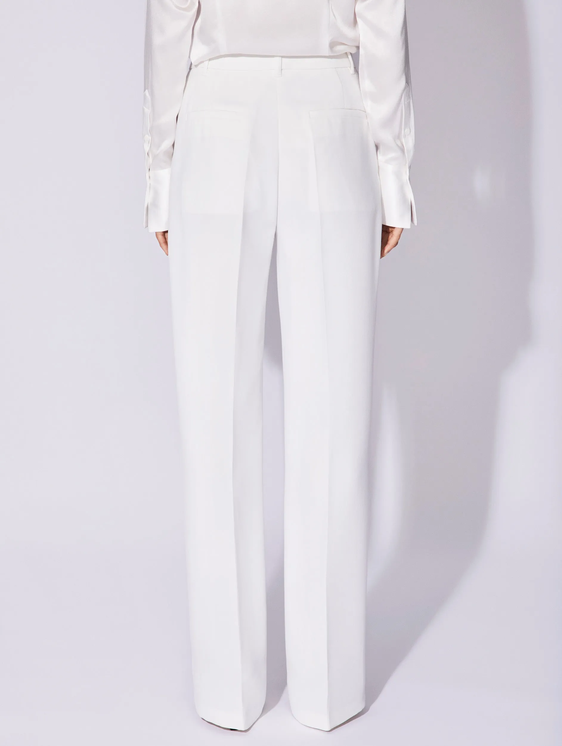 Flexible Activewear White crepe high waisted flared trousers