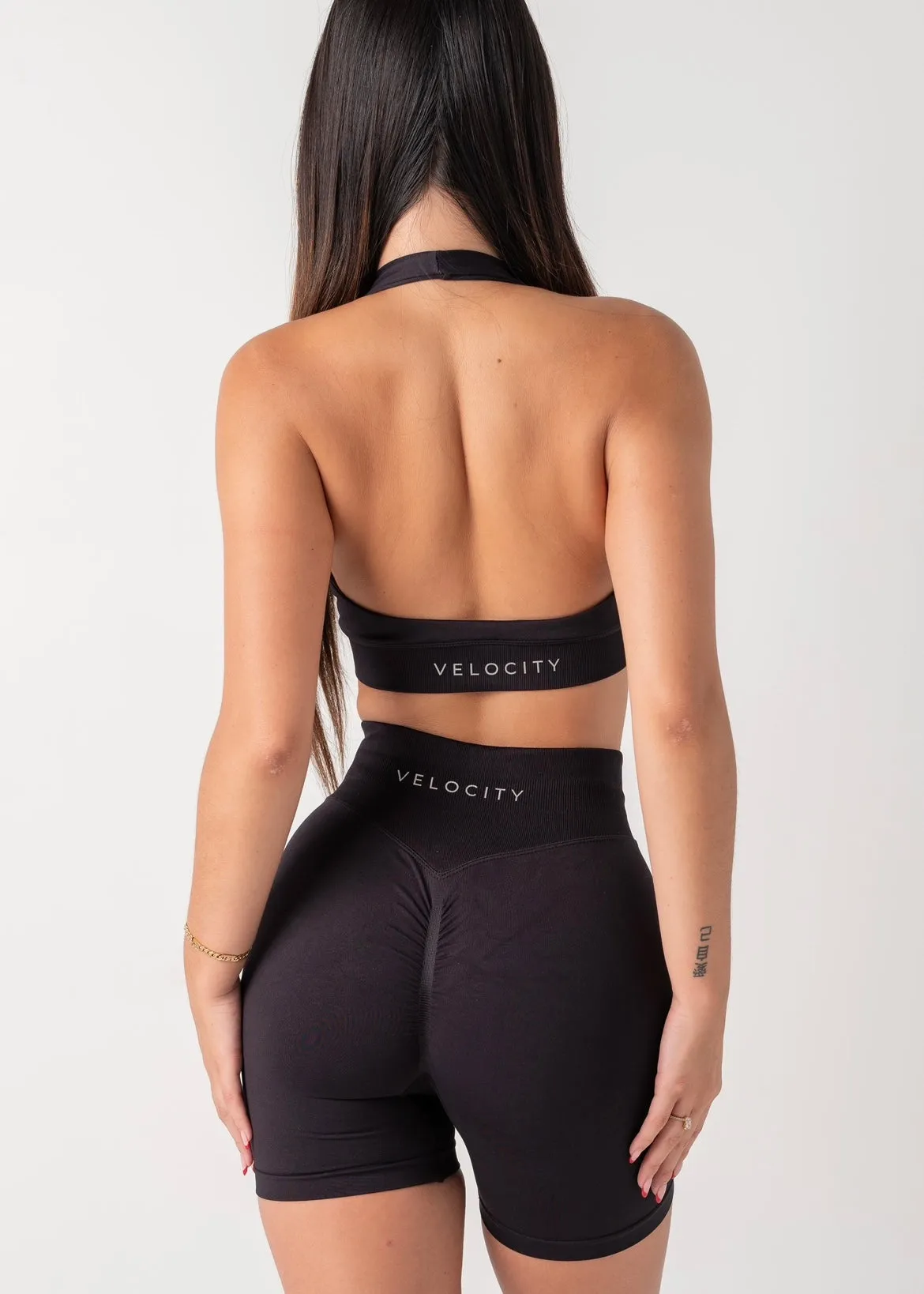 Elastic waistband seams Printed CURVE HALTER BRA - BLACK